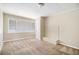 Spacious living room featuring a brick fireplace and large window at 4257 Midway Rd, Douglasville, GA 30134