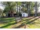Spacious backyard with a shed and wooden bench at 1396 Gale Dr, Norcross, GA 30093