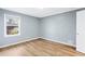 Bright bedroom with light grey walls and wood-look flooring at 1396 Gale Dr, Norcross, GA 30093