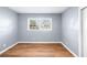 Simple bedroom with light gray walls and wood-look flooring at 1396 Gale Dr, Norcross, GA 30093