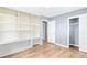 Bedroom with built-in shelving and closet, fresh paint and flooring at 1396 Gale Dr, Norcross, GA 30093