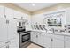 Kitchen with white cabinets and stainless steel appliances at 1396 Gale Dr, Norcross, GA 30093