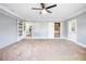 Bright living room with neutral walls, carpeting, and views to the kitchen at 1396 Gale Dr, Norcross, GA 30093
