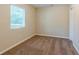 Simple bedroom with carpet, window with blinds, and closet at 3464 Linecrest Rd, Ellenwood, GA 30294