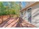 Spacious deck with wooden railings, and access from sliding glass door at 3464 Linecrest Rd, Ellenwood, GA 30294