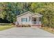 Charming one-story house with a covered porch and spacious driveway at 3464 Linecrest Rd, Ellenwood, GA 30294