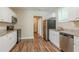 Modern kitchen with white cabinets and granite countertops at 3464 Linecrest Rd, Ellenwood, GA 30294