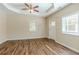 Bright and airy living room with wood-look floors and a ceiling fan at 3464 Linecrest Rd, Ellenwood, GA 30294
