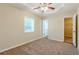Main bedroom with ceiling fan, carpet, and walk-in closet at 3464 Linecrest Rd, Ellenwood, GA 30294
