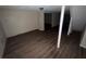 Unfinished basement with dark brown vinyl flooring at 214 Thornton Sw St, Atlanta, GA 30315