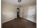Bedroom with brown carpet and neutral walls at 214 Thornton Sw St, Atlanta, GA 30315