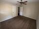 Well-lit bedroom with brown carpet and ceiling fan at 214 Thornton Sw St, Atlanta, GA 30315