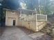 House with attached garage and steps leading to the entrance at 214 Thornton Sw St, Atlanta, GA 30315