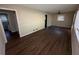 Bright living room with hardwood floors and access to other rooms at 214 Thornton Sw St, Atlanta, GA 30315