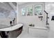 Spa-like bathroom with soaking tub, walk-in shower, and modern fixtures at 3220 Dogwood Dr, Hapeville, GA 30354