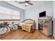 Cozy bedroom with hardwood floors and built-in shelving at 3220 Dogwood Dr, Hapeville, GA 30354
