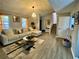 Spacious living room with L-shaped sofa and hardwood floors at 5343 Highway 5, Douglasville, GA 30135