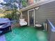 Deck with artificial turf, chair, small table, and grill at 5343 Highway 5, Douglasville, GA 30135