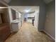 Spacious kitchen with white cabinets and tile floors at 334 Royal Crescent Way, Stockbridge, GA 30281