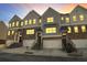 Three-story townhouses with attached garages and stairs at 4262 Buford Valley Way, Buford, GA 30518