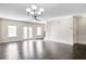 Bright living room with hardwood floors and access to balcony at 4262 Buford Valley Way, Buford, GA 30518