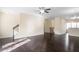 Spacious living room with hardwood floors and access to upper level at 4262 Buford Valley Way, Buford, GA 30518