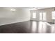 Open living room with hardwood floors and kitchen views at 4262 Buford Valley Way, Buford, GA 30518