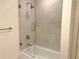 Bathroom with tub and glass shower door at 3630 Peachtree Ne Rd # 2305, Atlanta, GA 30326