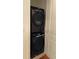 Stackable washer and dryer in a well-lit laundry room at 3630 Peachtree Ne Rd # 2305, Atlanta, GA 30326