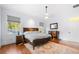 Spacious primary bedroom with hardwood floors and large windows at 61 Alden Nw Ave, Atlanta, GA 30309