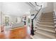 Elegant entryway with hardwood floors, a staircase, and views into the living room at 61 Alden Nw Ave, Atlanta, GA 30309