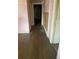 Long hallway with pink walls and hardwood floors at 169 Moreland Se Ave, Atlanta, GA 30316
