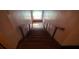 Staircase with wooden railing and pink walls at 169 Moreland Se Ave, Atlanta, GA 30316