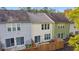 Aerial view of townhouses with various colors and wooden fences at 247 Kigian Trl, Woodstock, GA 30188