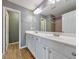 Double vanity bathroom with a large mirror and updated fixtures at 247 Kigian Trl, Woodstock, GA 30188
