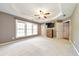 Primary bedroom featuring ceiling fan and large windows at 247 Kigian Trl, Woodstock, GA 30188