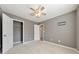Spacious bedroom with neutral walls, carpet, ceiling fan and walk-in closet at 247 Kigian Trl, Woodstock, GA 30188