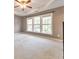 Bright bedroom with large windows and plush carpeting at 247 Kigian Trl, Woodstock, GA 30188