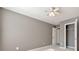 Simple bedroom with ceiling fan and closet at 247 Kigian Trl, Woodstock, GA 30188