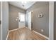 Light-filled foyer with wood-look flooring and neutral walls at 247 Kigian Trl, Woodstock, GA 30188