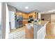 Modern kitchen with granite counters, stainless steel appliances, and wood cabinets at 247 Kigian Trl, Woodstock, GA 30188