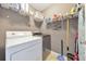 Laundry room with washer, dryer, and ample shelving at 247 Kigian Trl, Woodstock, GA 30188