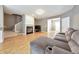Open living area with hardwood floors and a cozy fireplace at 247 Kigian Trl, Woodstock, GA 30188
