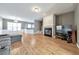 Spacious living room with hardwood floors, fireplace, and ample natural light at 247 Kigian Trl, Woodstock, GA 30188