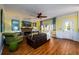 Bright living room with hardwood floors, fireplace, and access to backyard at 1379 Christiana Dr, Lawrenceville, GA 30043