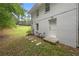 Small patio with sitting area adjacent to house at 6650 Queen Mill Se Rd, Mableton, GA 30126