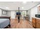 Finished basement bedroom with kitchenette and hardwood floors at 6650 Queen Mill Se Rd, Mableton, GA 30126