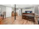 Finished basement bedroom with kitchenette and hardwood floors at 6650 Queen Mill Se Rd, Mableton, GA 30126