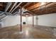 Unfinished basement with high ceilings and concrete floor at 6650 Queen Mill Se Rd, Mableton, GA 30126