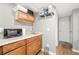 Basement kitchenette with microwave, cabinets and sink at 6650 Queen Mill Se Rd, Mableton, GA 30126